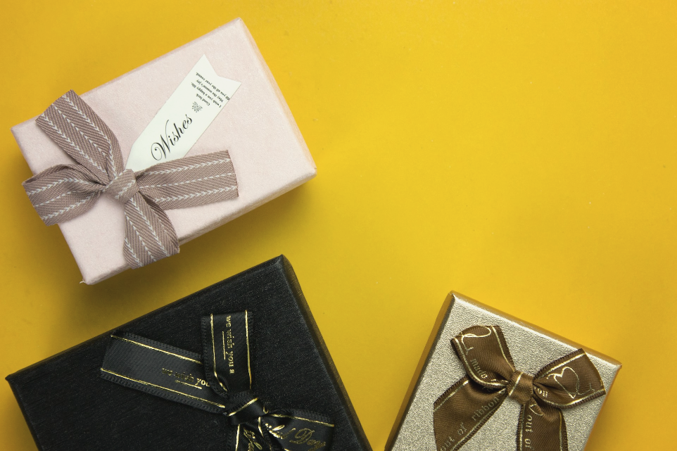 a couple of wrapped presents sitting on top of a table